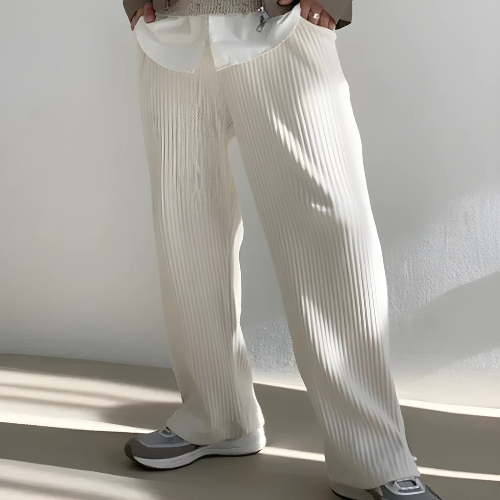 Men's loose corduroy casual pants in solid colour with high waist, drawstring no-fly closure and ankle-tied cuffs.