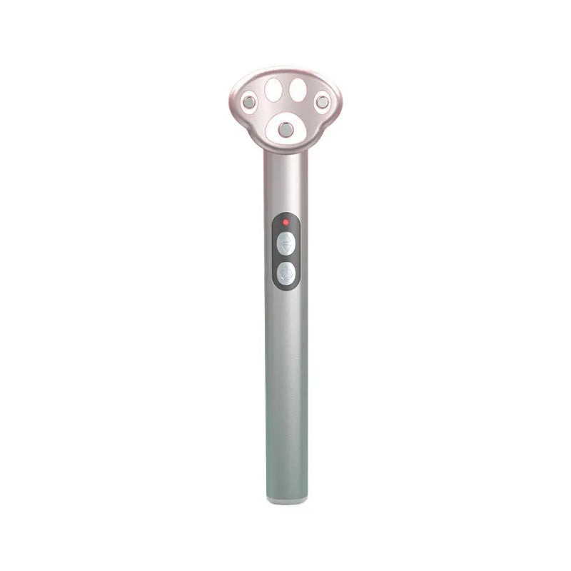 Gradient pink Cat's Paw shape micro-current eye massager with colour light therapy on a white background.