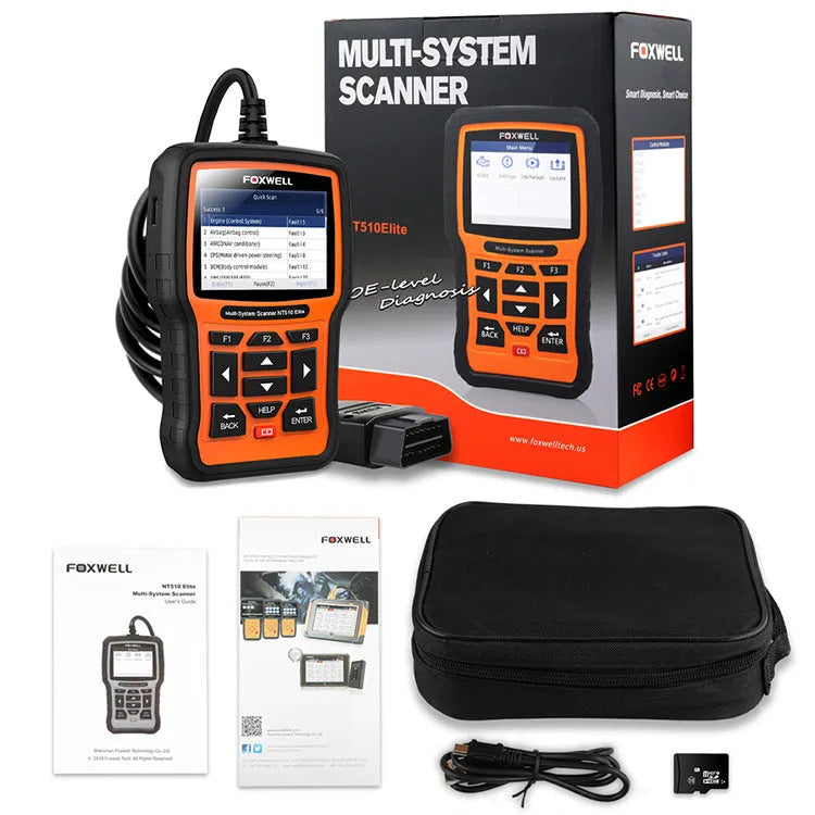 Foxwell NT510 orange and black automotive diagnostic tool with data cable on a workshop bench