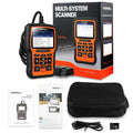 Foxwell NT510 orange and black automotive diagnostic tool with data cable on a workshop bench