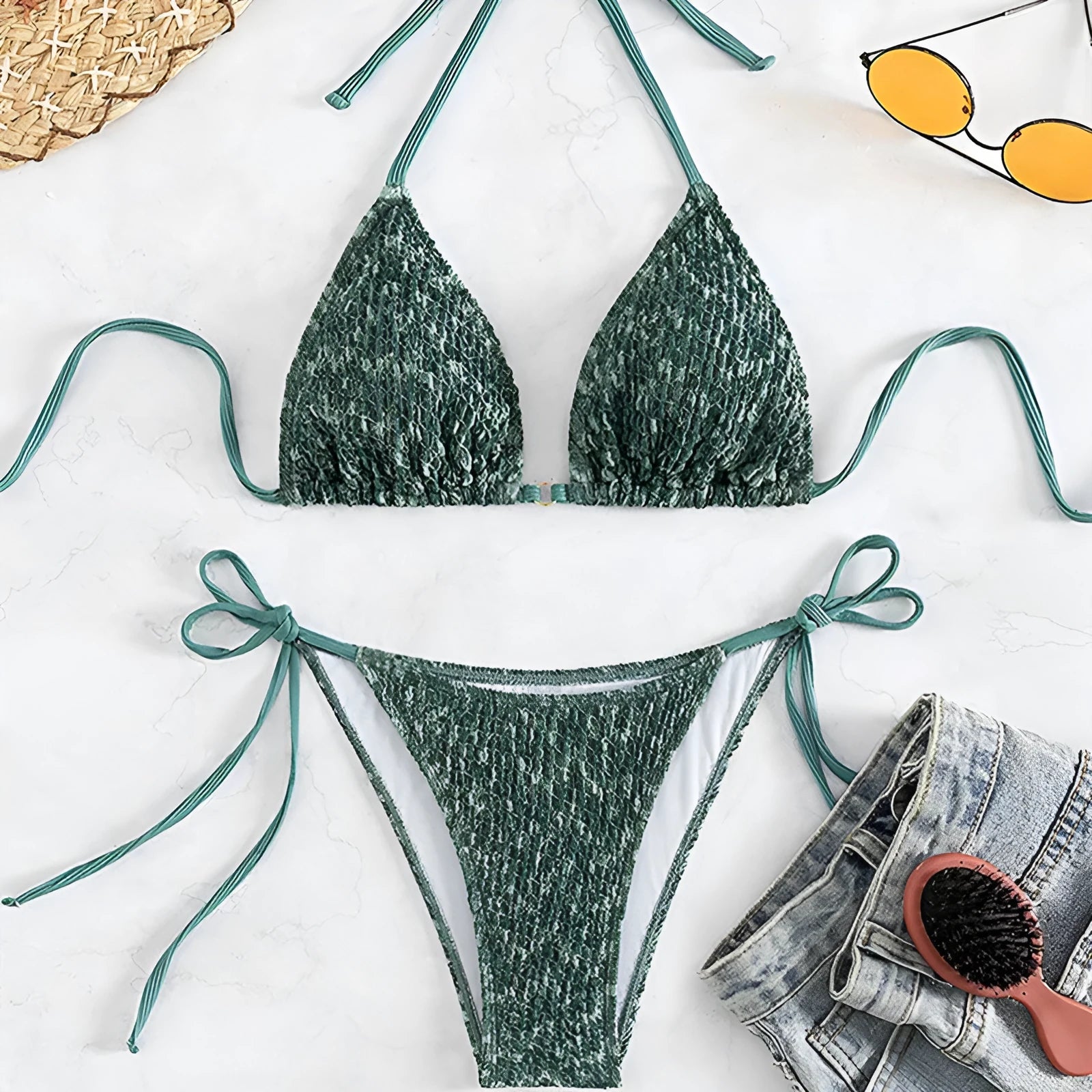 Green women's halter backless swimsuit set with matching shorts
