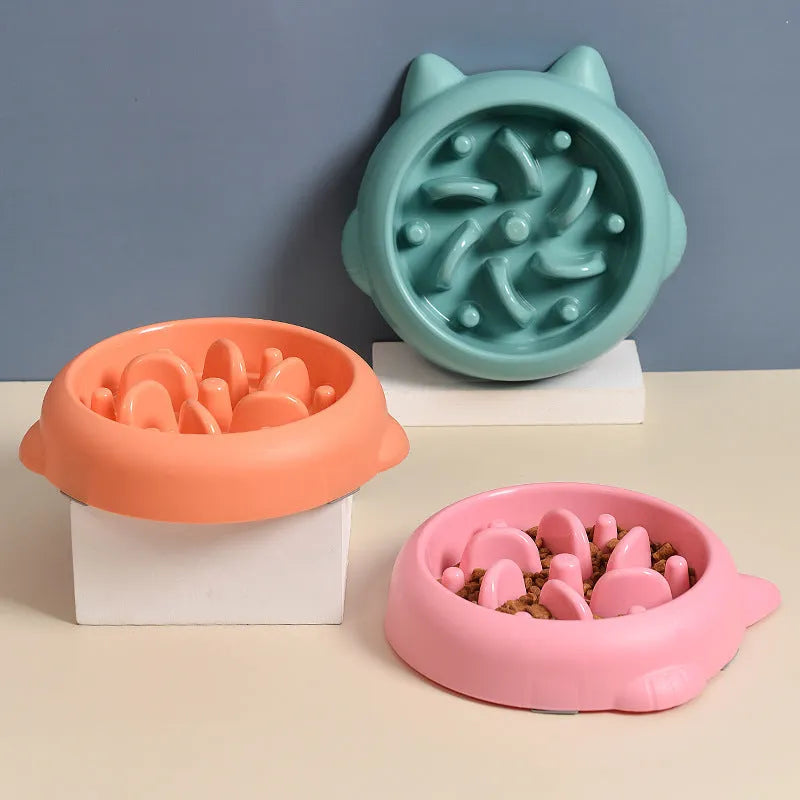 Green bone-shaped slow feeder dog bowl with raised ridges to prevent fast eating.