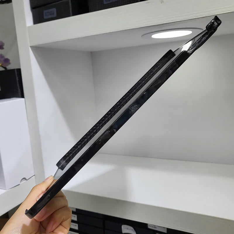 Carbon fibre flat protective cover for iPad Pro 11 showing embossed plaid pattern and precise port cutouts