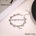 Stainless steel women's bracelet with a hollowed-out heart design in gold, steel, or colour-blocked finish.