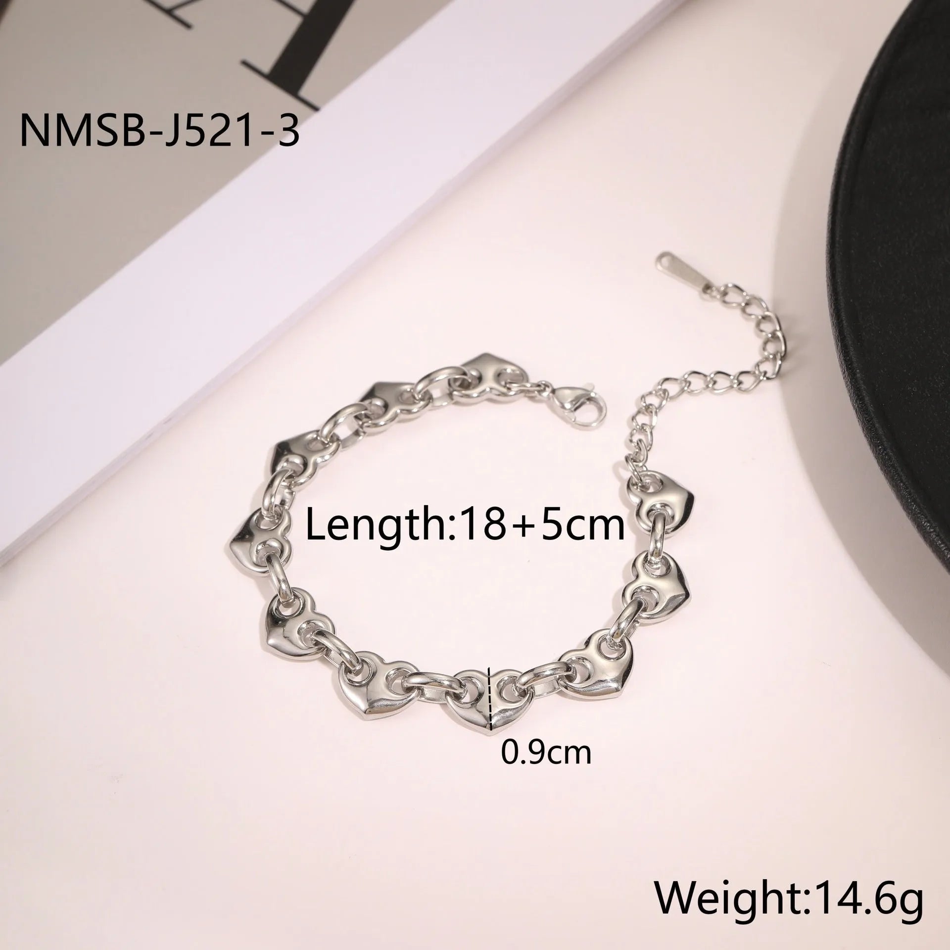 Stainless steel women's bracelet with a hollowed-out heart design in gold, steel, or colour-blocked finish.