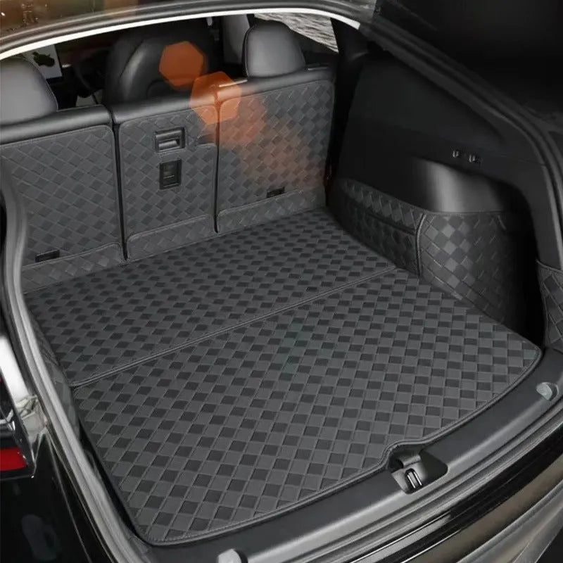 Leather trunk mat for Tesla Model 3 and Model Y in black, shown in car boot.