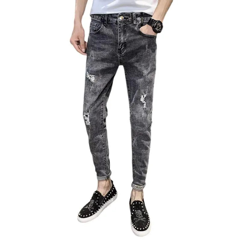 Men's high-waisted cotton denim jeans in a basic style with a button fly.