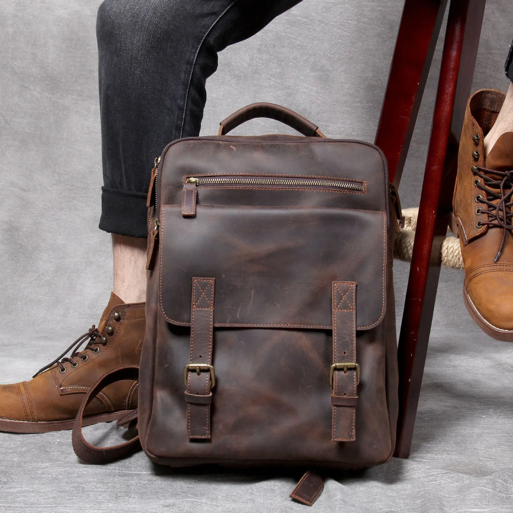 Dark coffee coloured handmade leather backpack with internal computer and mobile phone pockets.