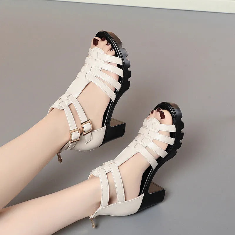 Women's beige hollow-out high heel sandals with rhinestones and a buckle fastening.