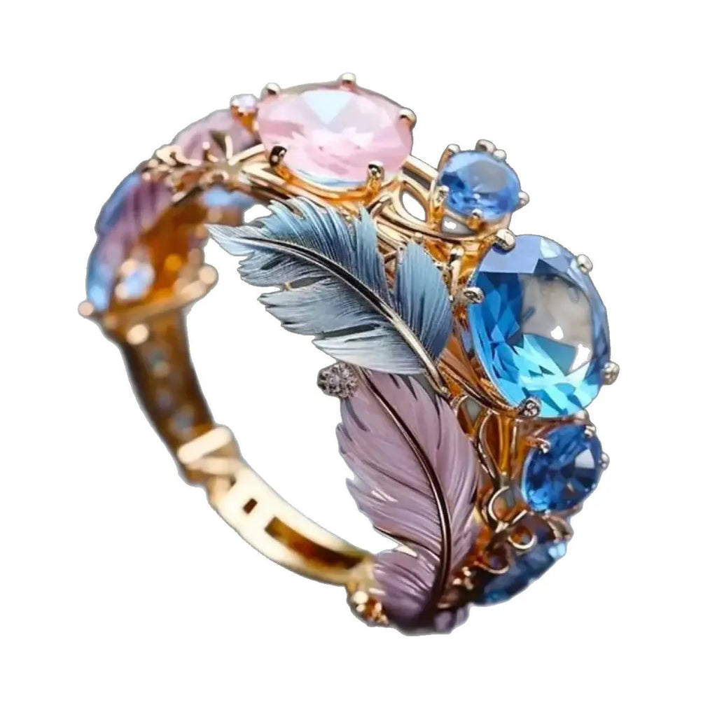 Gold colour brass feather ring with geometric embossed design and colourful zircon stone inlay