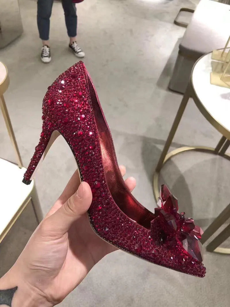 Women's gold pointed toe high heels with rhinestones and sequins on a 7cm stiletto heel