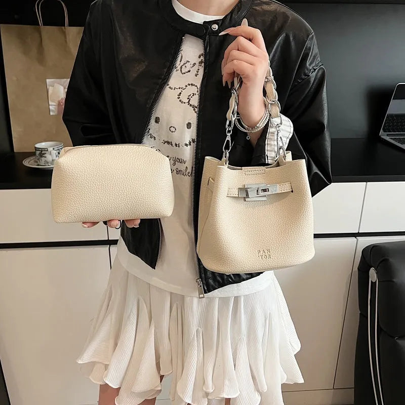 Soft black PU leather retro bucket shoulder bag showing interior phone and zipped pockets.