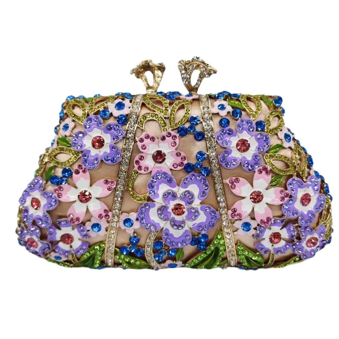 Gold oval metal evening clutch with enamel flower, hollow, diamond and dripping oil detail, 22cm long