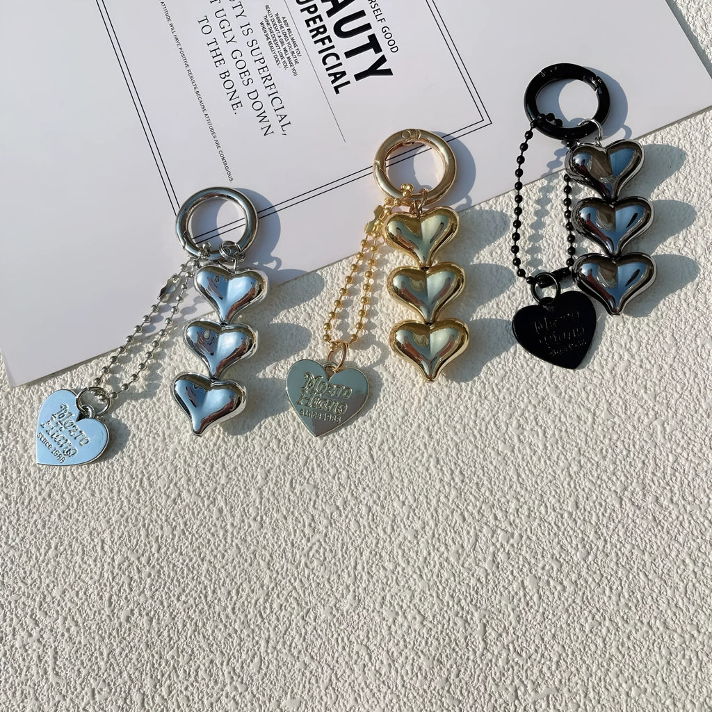 Love heart shaped acrylic charm keychain on an electroplated metal ring in silver finish.