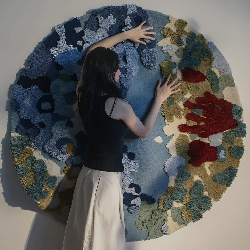 Ocean blue handmade wool round carpet on wooden floor showing tufted texture and circular shape