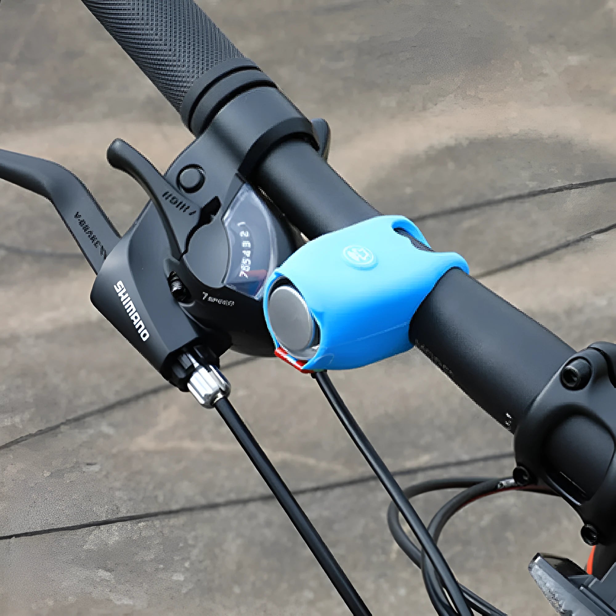 Electronic bicycle horn in multiple colours showing compact plastic design for handlebar mounting.