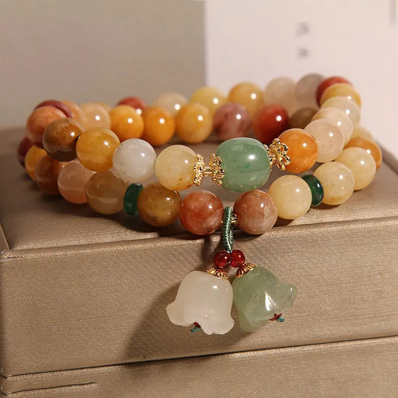 Natural jinsi jade multi-layer bracelet for women showing adjustable knotted design with orchid pendant detail