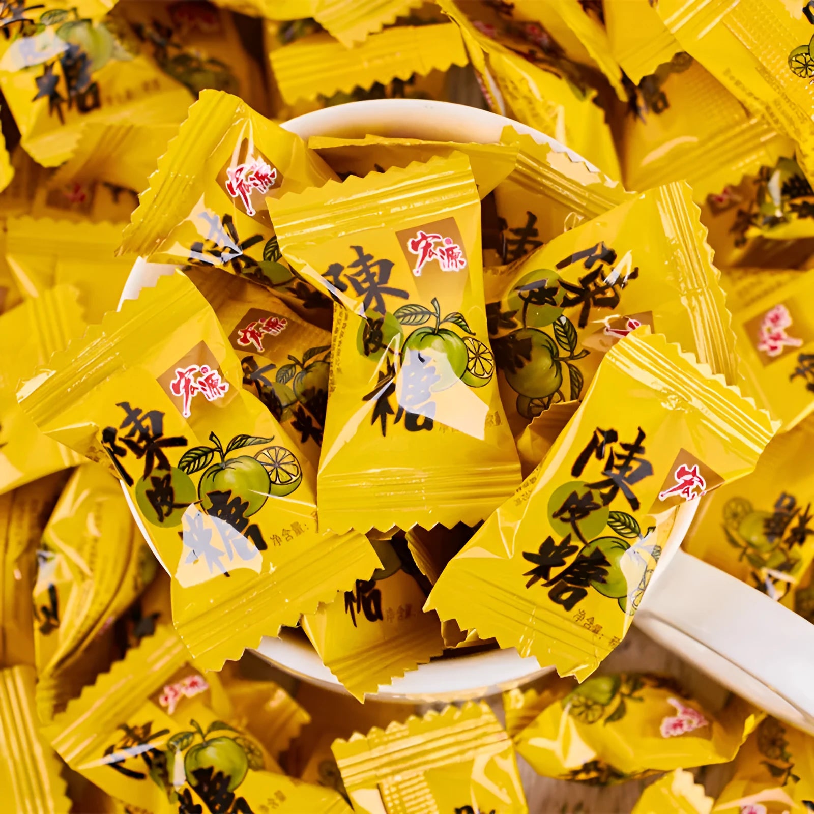 Assortment pack of plum sugar, guava, and tangerine peel flavoured hard candies in separate bags.