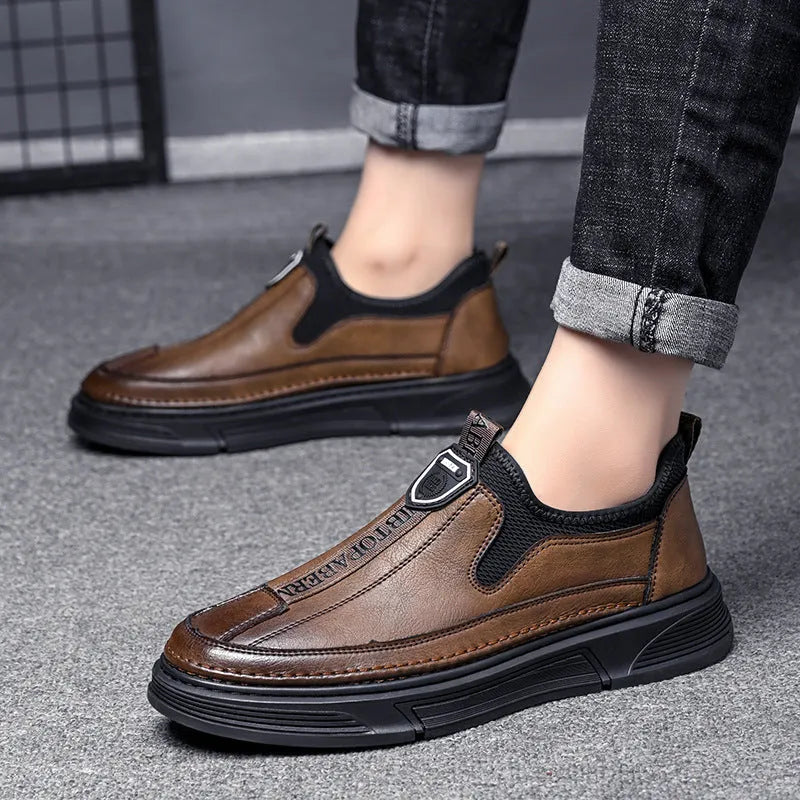 Men's solid colour leather casual shoes with round toe in black and brown colour options.