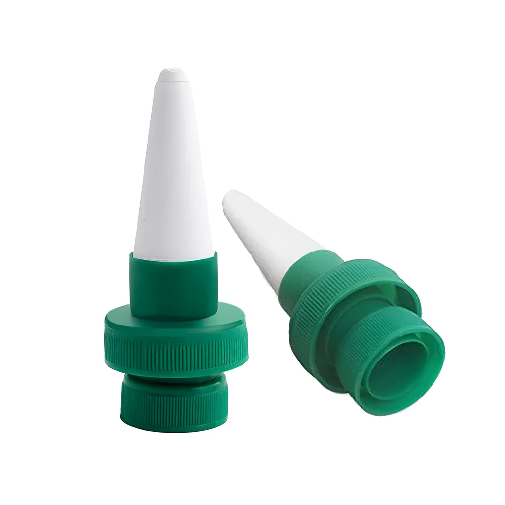 Green ceramic automatic water dripper for plant irrigation attached to a bottle.