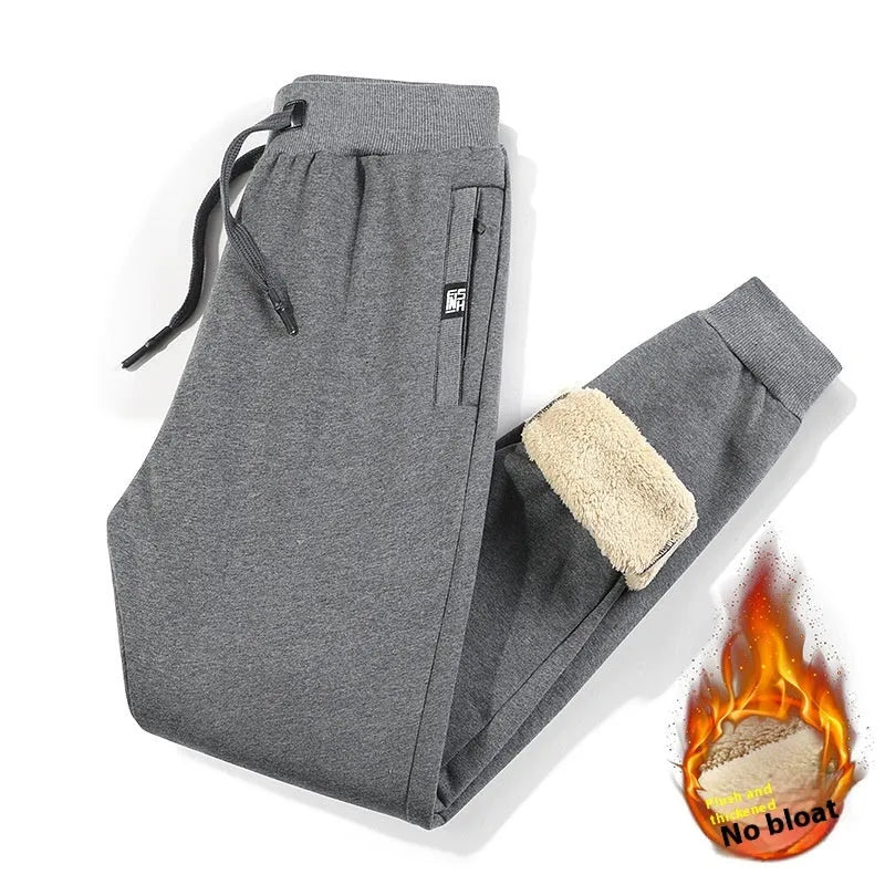 Men's grey fleece-lined cotton track pants with straight legs, showcasing mid-waist design and micro-elastic fabric for plus-size fit.