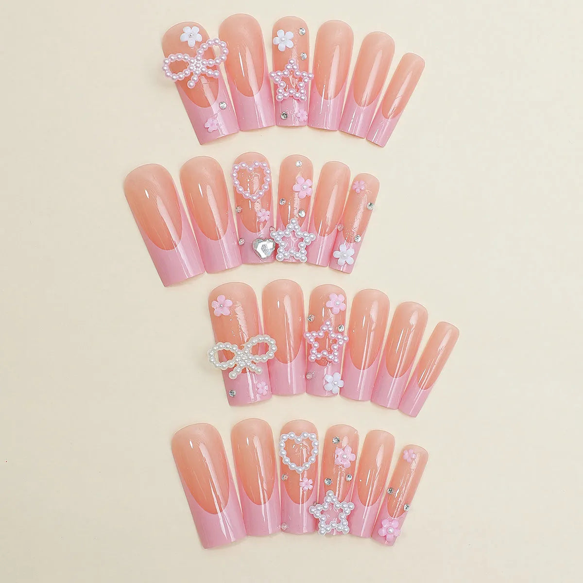 Super long French manicure nails with spot drill detailing and bow accent in XB-70-48 colour