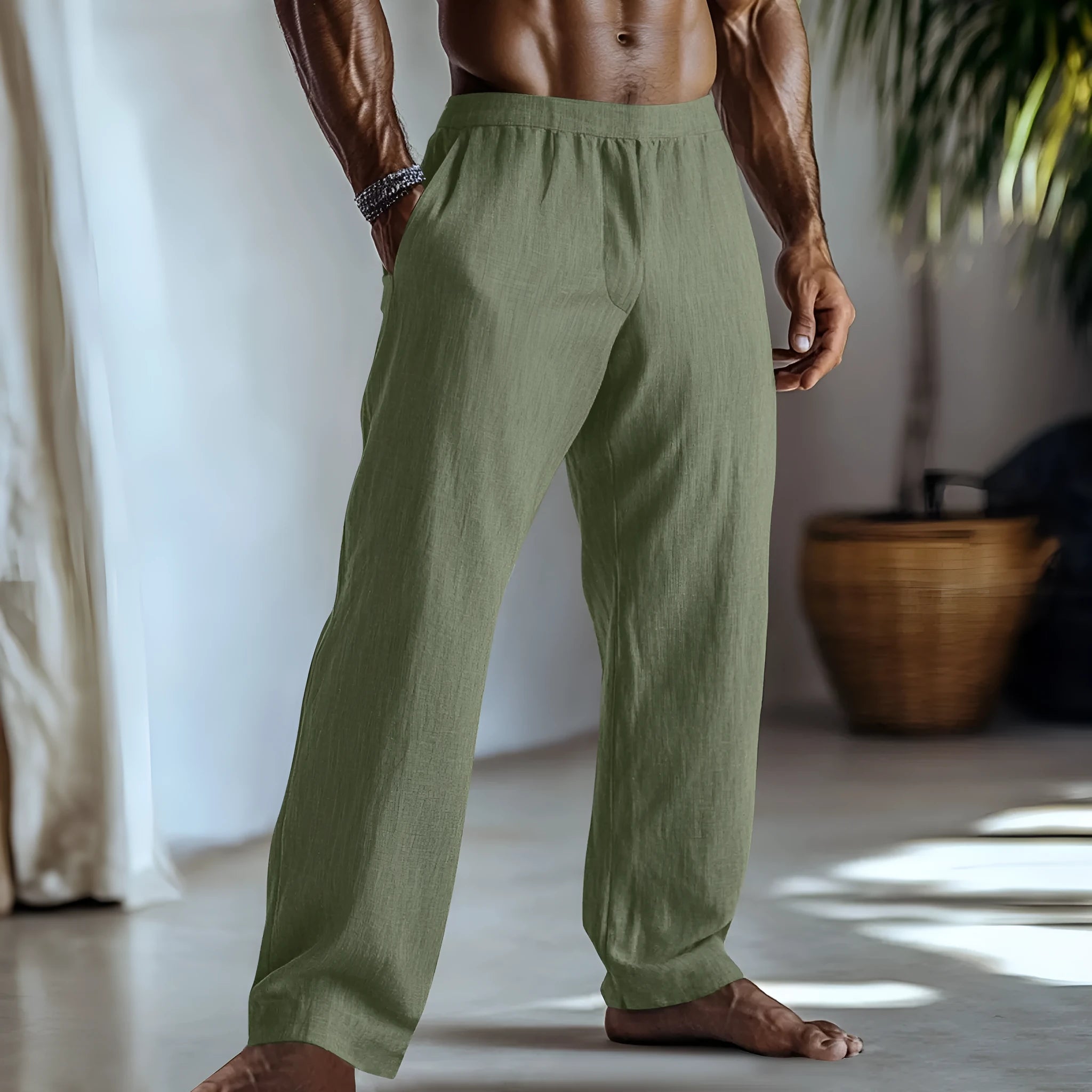 Cotton and linen straight-leg trousers in light green colour with multiple pockets, showing British style design.