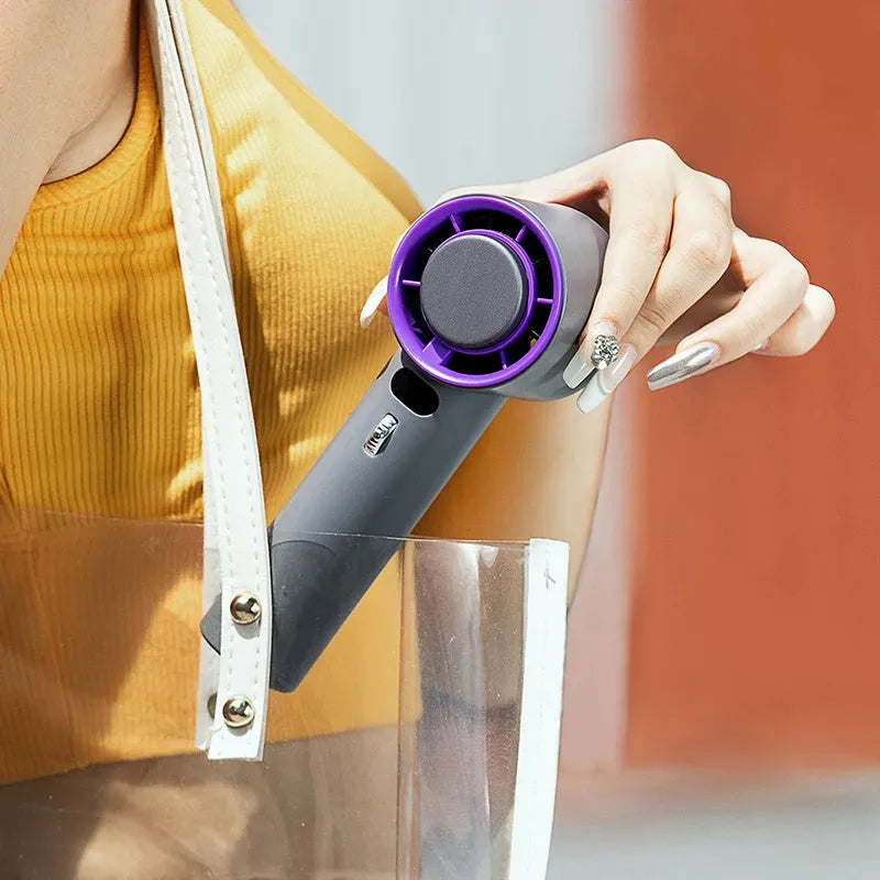 White and grey portable handheld turbo fan with semiconductor cooling and adjustable speeds.