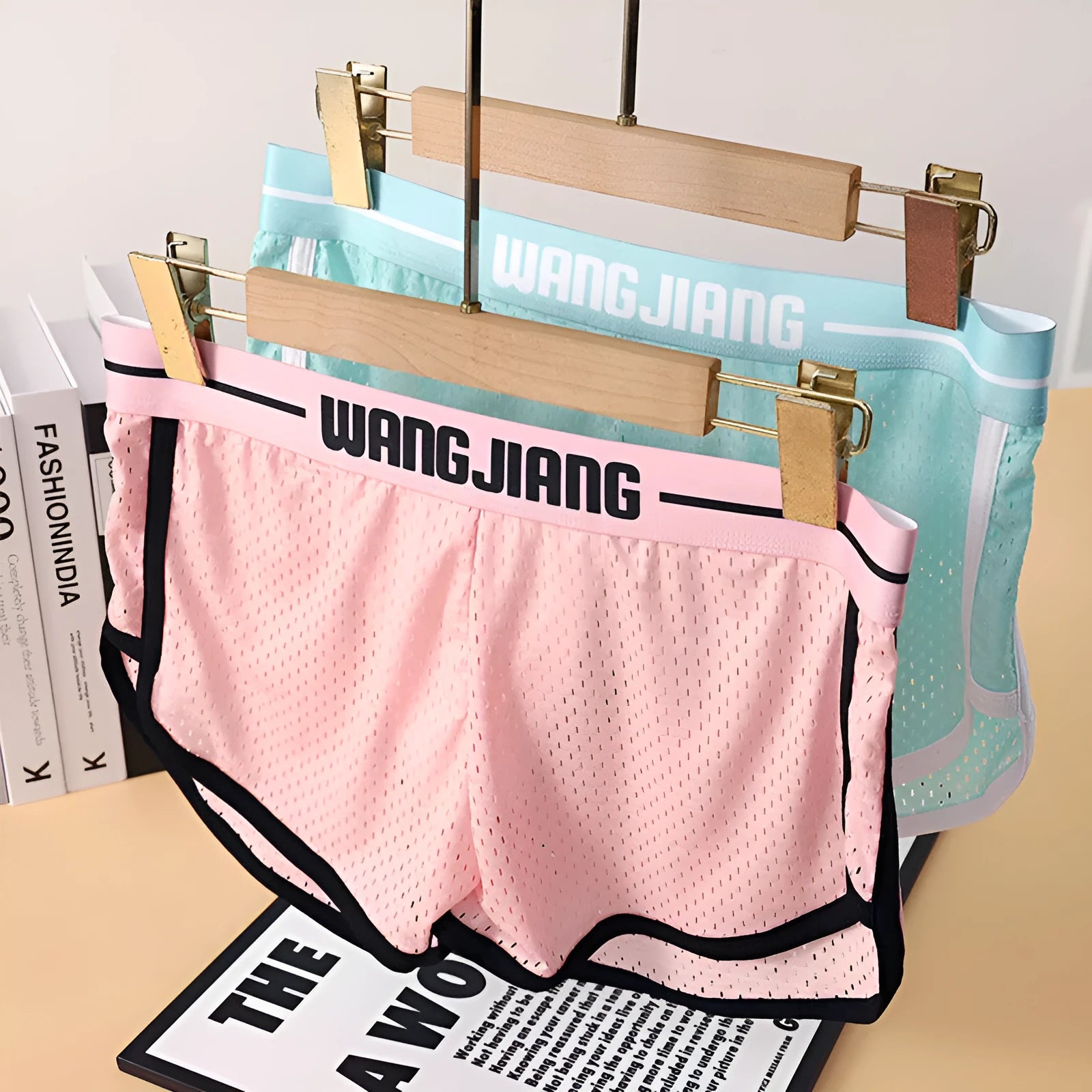 Men's loose fit boxers in Ice Silk fabric shown in black, white, dark grey, blue, pink, or light green.