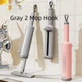 Pink self-squeeze mini mop with microfiber pads and crevice brush for floor cleaning