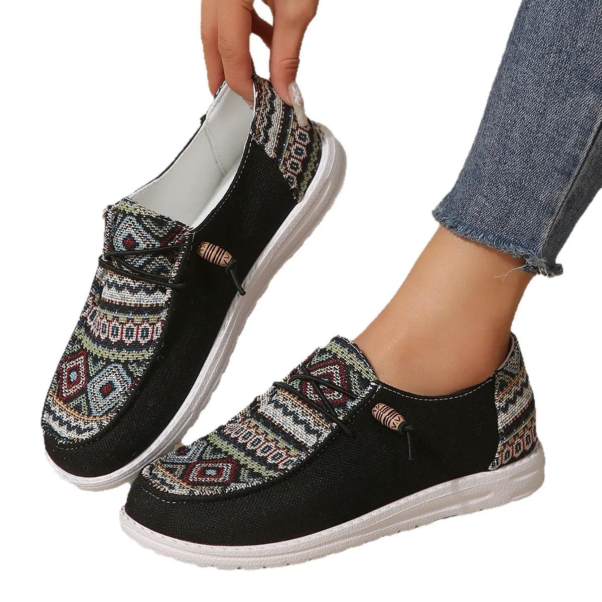 Women's black round toe flat shoes with low-top design and rubber soles