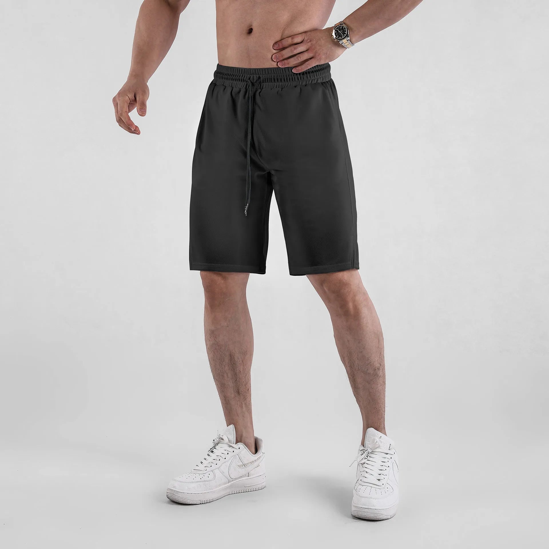 Men's quick-drying mesh shorts in black or white, loose fit for summer fitness