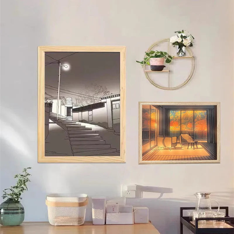 Modern rectangular acrylic LED light painting showing a serene landscape scene, illuminated from behind on a bedside table.