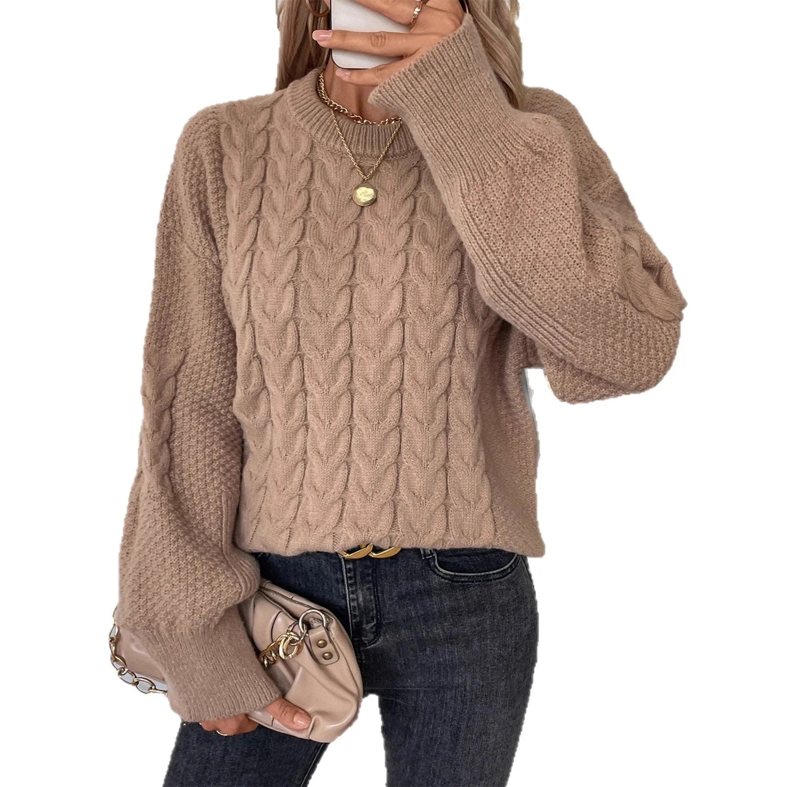 Beige women's loose round neck casual pullover sweater with textured thread detail on a hanger.