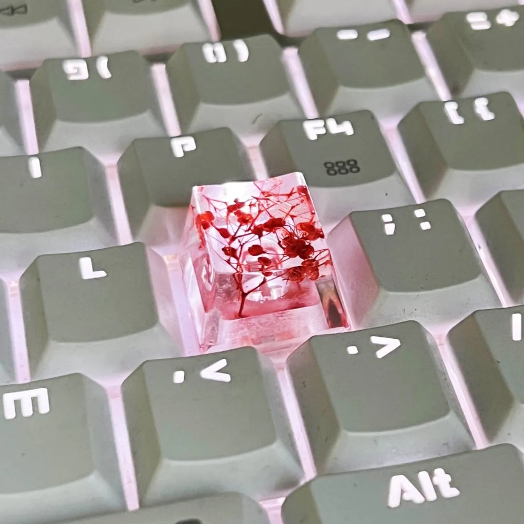 Translucent resin starry sky keycap with glitter particles measuring 1.8cm by 1.2cm