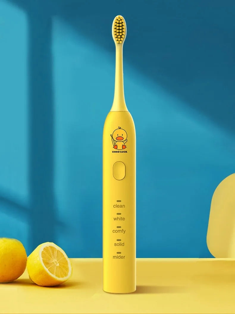 Yellow duck designed rechargeable electric toothbrush with USB port and soft bristle head.