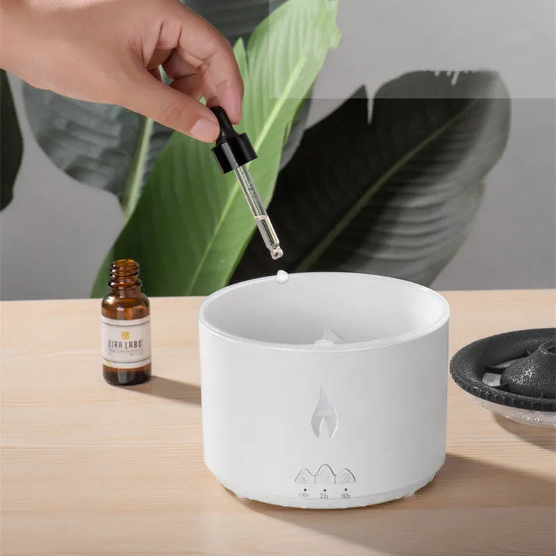Round white volcano-shaped humidifier with water tank and single fog outlet on wooden surface