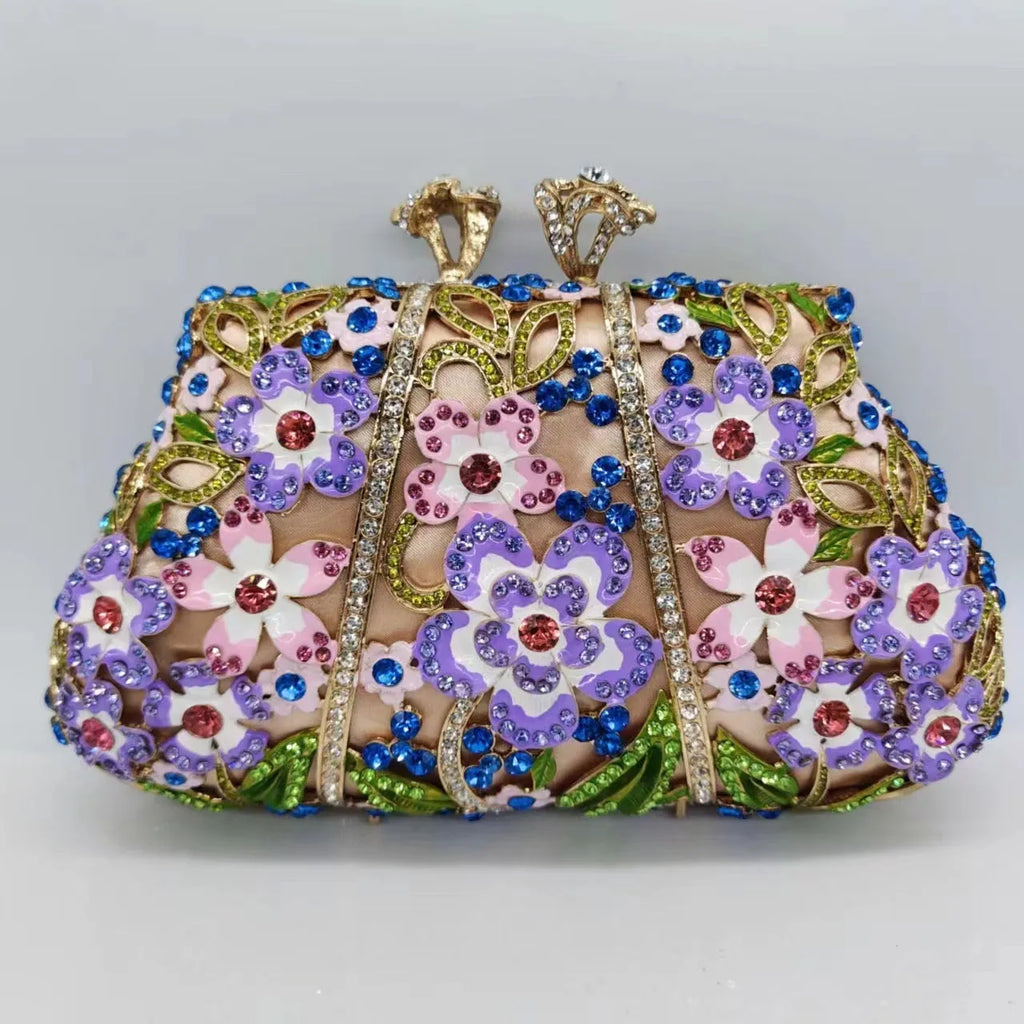 Gold oval metal evening clutch with enamel flower, hollow, diamond and dripping oil detail, 22cm long