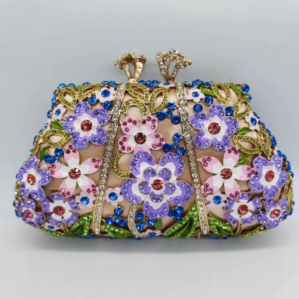 Gold oval metal evening clutch with enamel flower, hollow, diamond and dripping oil detail, 22cm long