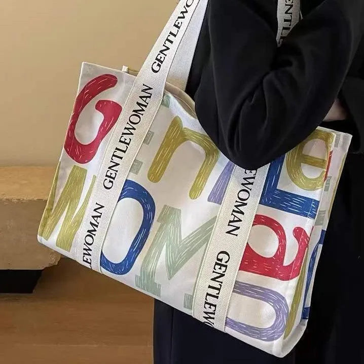 Canvas women's tote bag with printed design showing 45cm width and shoulder strap
