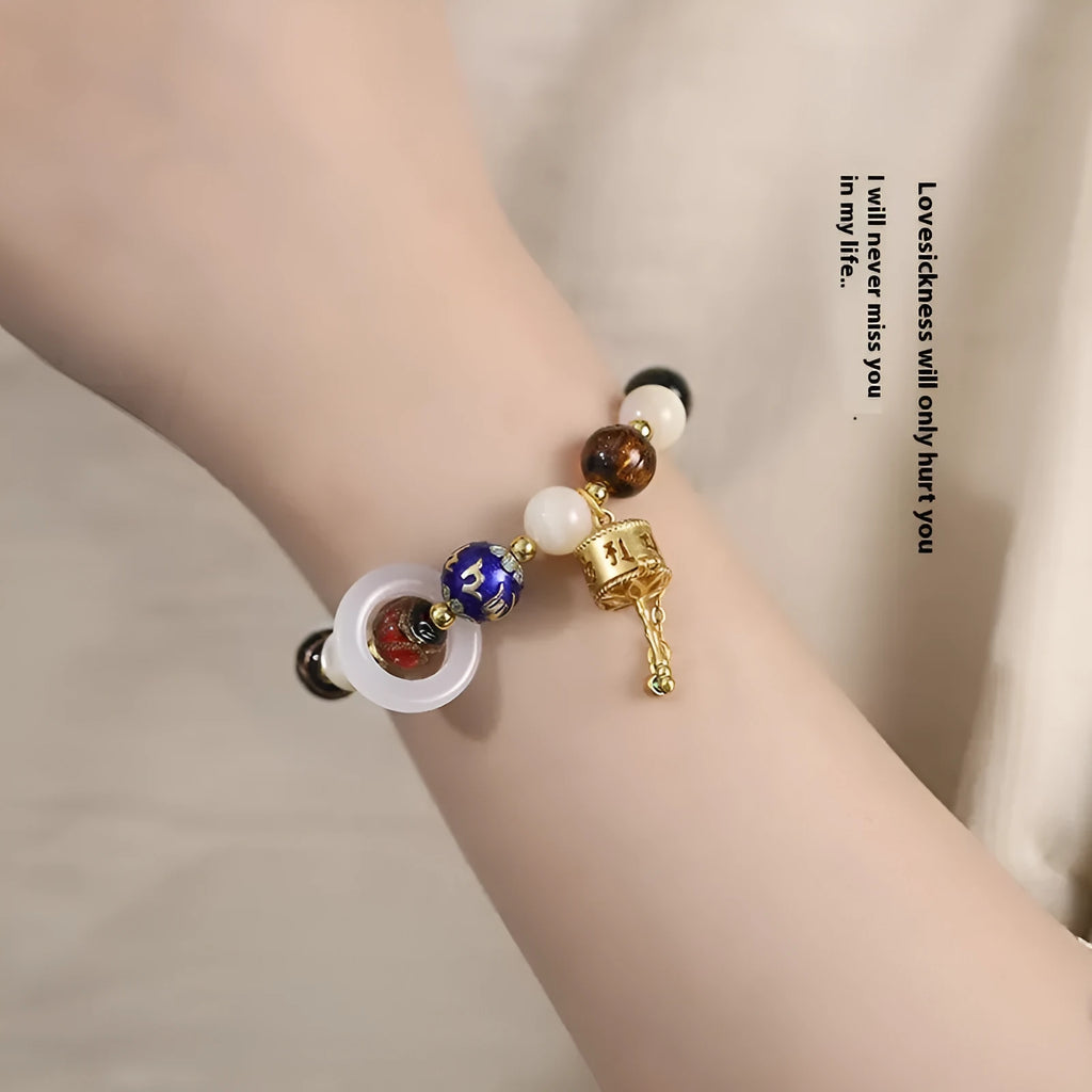 Hand-woven fragrant grey coloured glaze bracelet with round sunstone or white lip shell beads.