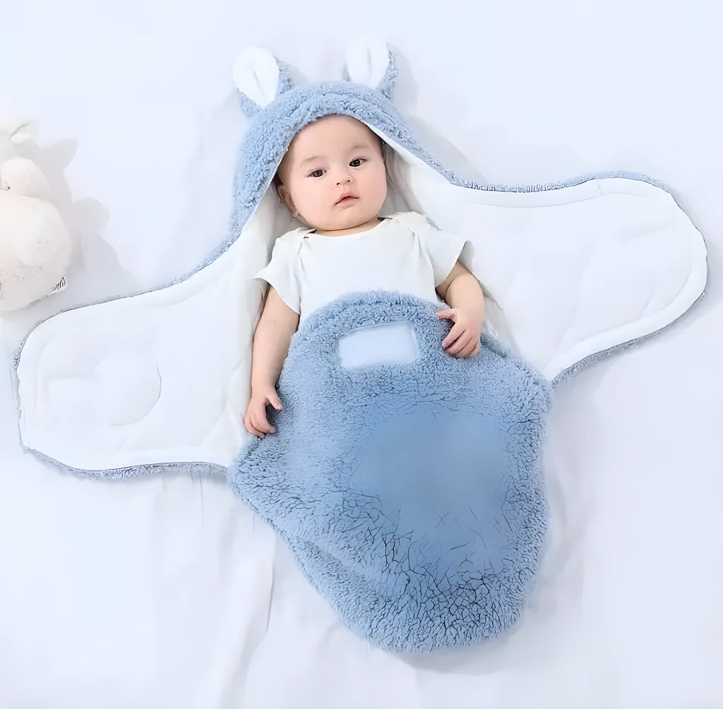 Baby wearing adjustable cotton swaddle sleep sack with velcro closure