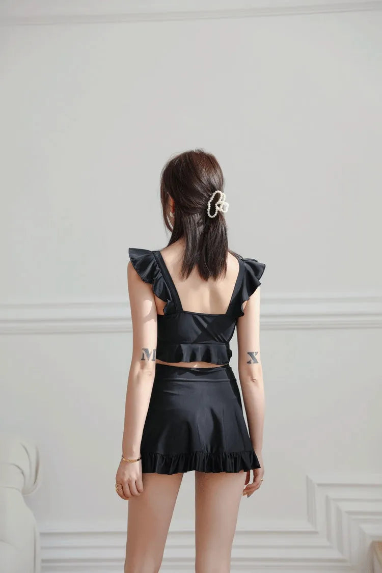 Black nylon swimsuit for women with split brief design