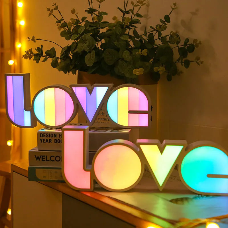 Valentine's Day LED LOVE light with rainbow-style plastic shade, measuring 35.5cm, for romantic room decor