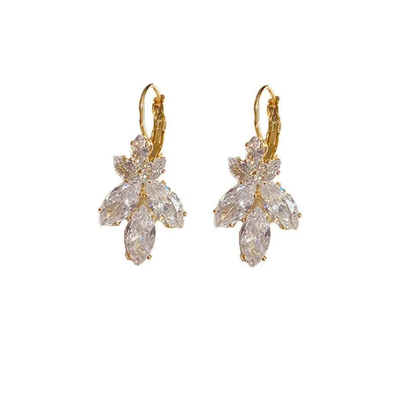 A pair of platinum-coloured alloy earrings in a leaf shape with an inlaid zircon shiny finish.