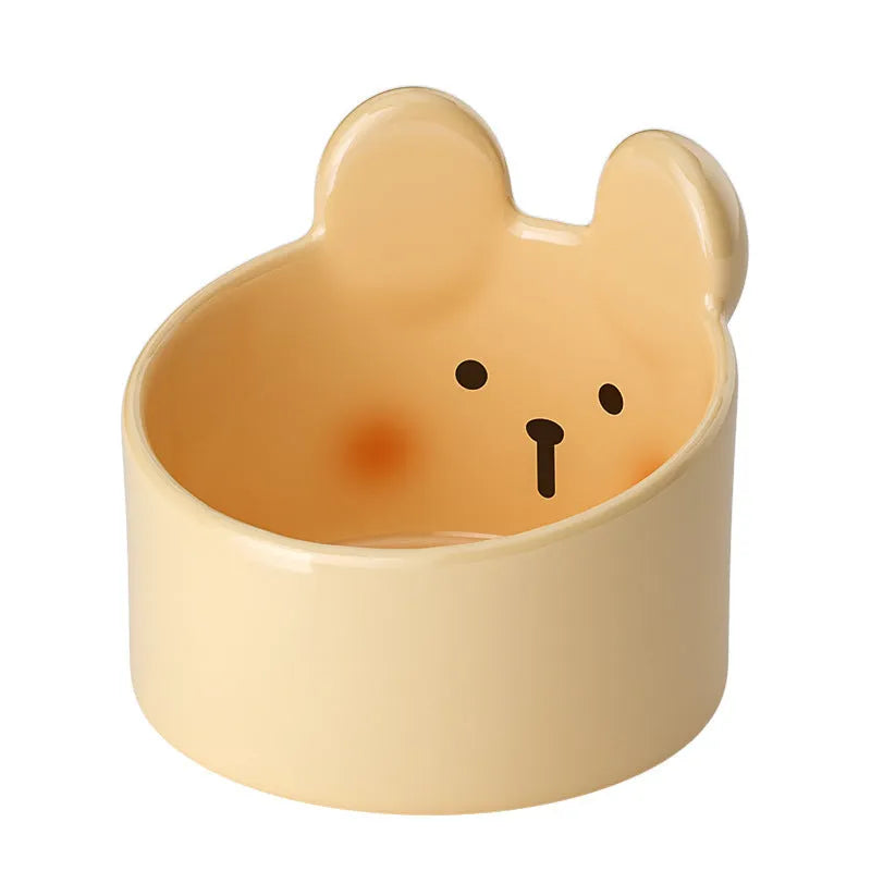 Ceramic pet bowl with neck guard design in white rabbit pattern, shown next to a large brown bear pattern bowl.