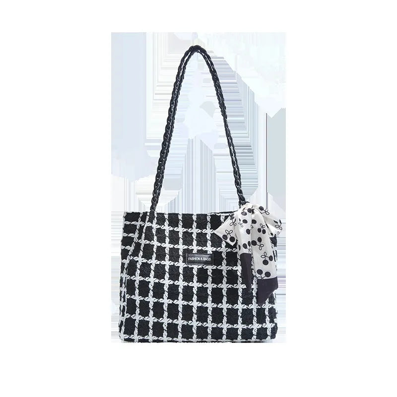 Black woolen shoulder bag with horizontal square shape showing internal organisation compartments