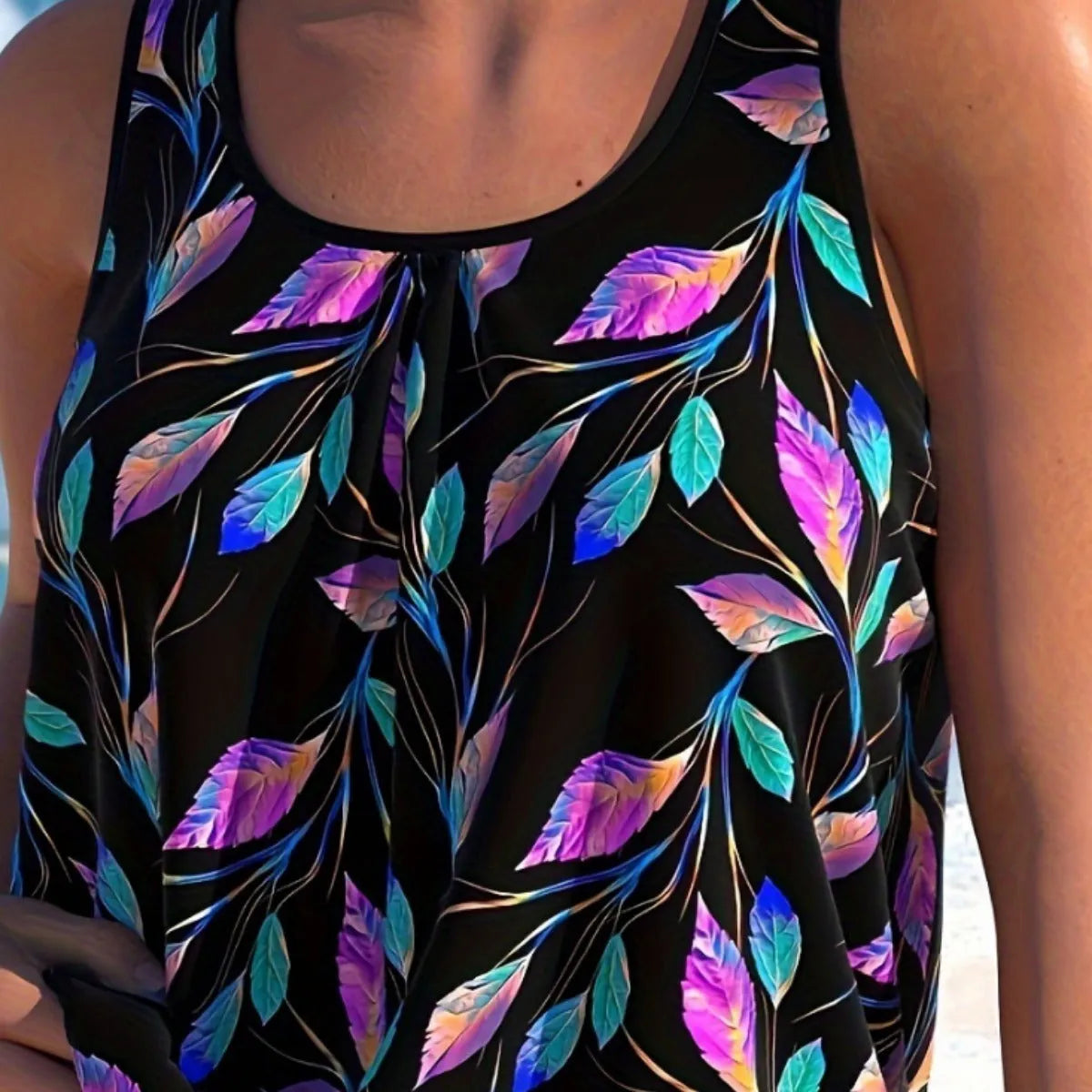 Women's leaf design two-piece swimsuit set with top and shorts on a neutral background.