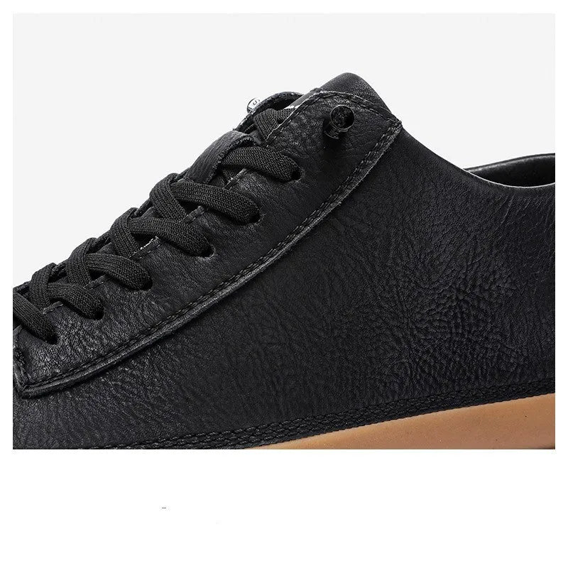 Men's black casual leather shoes with round toe, flat heel, and lanyard closure on neutral background