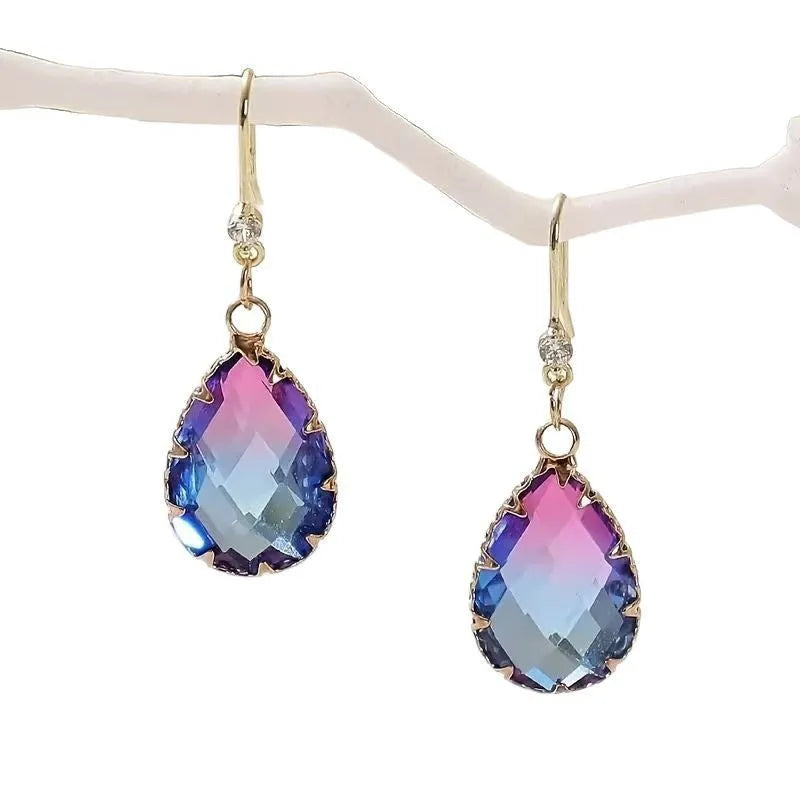 Pair of women's heart-shaped drop earrings in coloured glaze, showing one of four colour options.